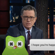 Stephen Colbert presents "The Late Show" with a cartoon of Duo the Owl overlaid on the screen.